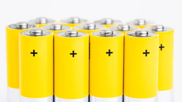 AA alkaline batteries on white background. — Stock Photo, Image