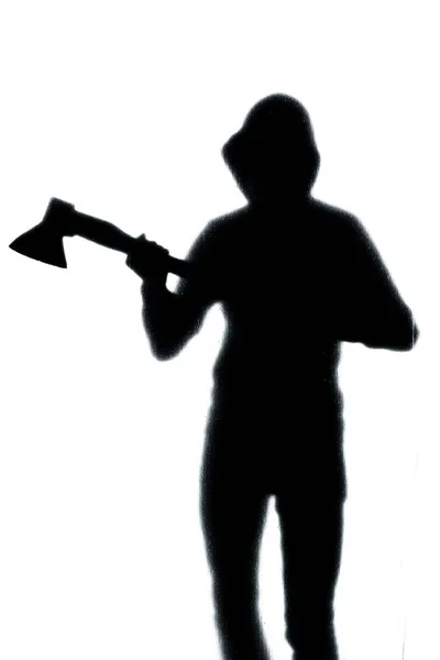 Dangerous man behind frosted glass with an axe in his hand. Hall — Stock Photo, Image
