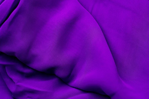 Textuur van de satijnen stof van lila kleur voor de achtergrond. — Stockfoto