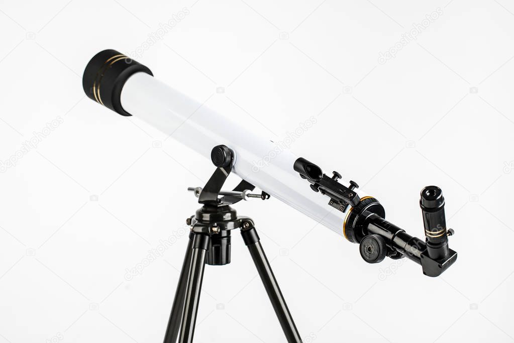 white telescope on tripod isolated on white background.