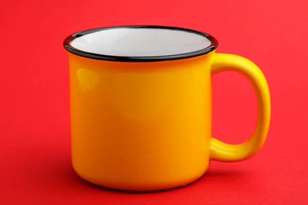 Iron mug, on red background. — Stock Photo, Image