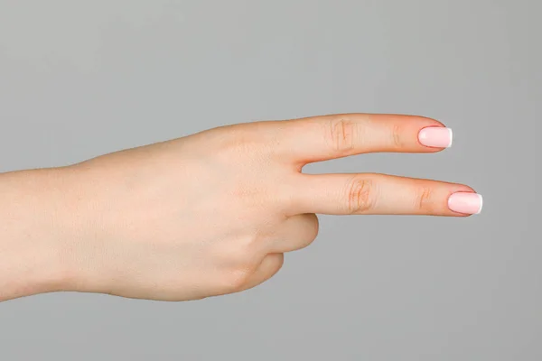 Female hand on white background. — Stock Photo, Image