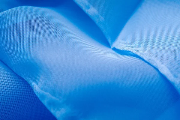 Blue satin fabric texture for the background. — Stockfoto