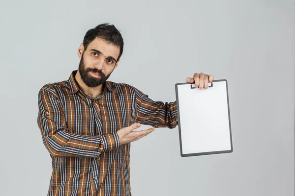 Portrait of an Arab man holding a white blank panel with space f — Stock Photo, Image