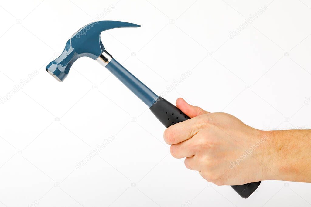 A man's hand holding a hammer is isolated on a white background.