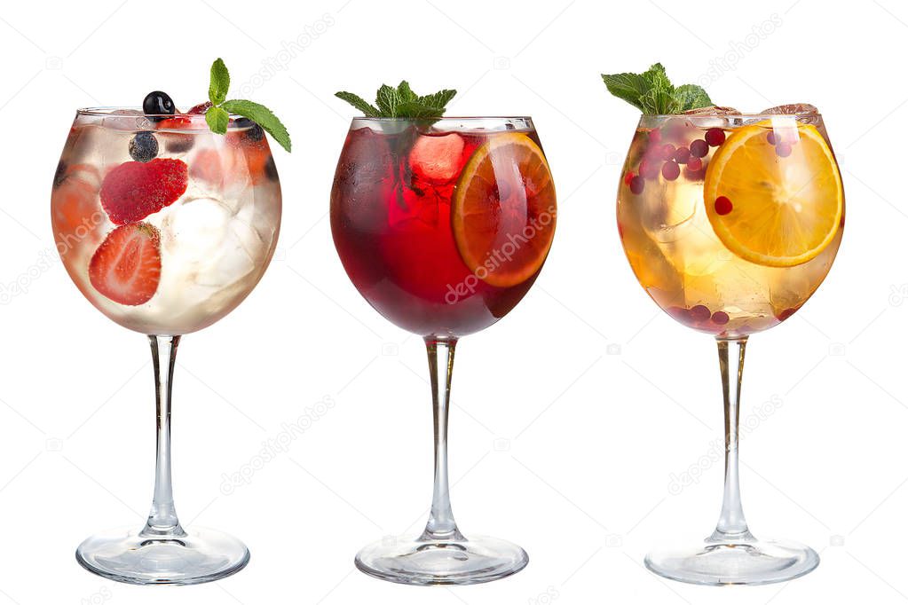 Alcoholic and non-alcoholic cocktails with mint, fruits and berries on a white background. Three cocktails in glass goblets. Isolated.