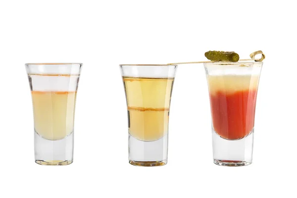 Set of alcohol shots on a white background. Three shots different with strong alcohol.