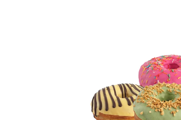 Verschillende heldere smakelijke donuts op een witte achtergrond. Plaats onder de tekst. Diversiteit. — Stockfoto