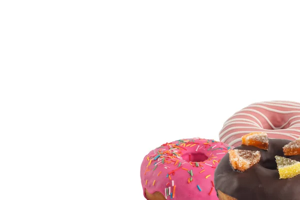 Verschiedene helle leckere Donuts auf weißem Hintergrund. unter dem Text platzieren. Vielfalt. — Stockfoto