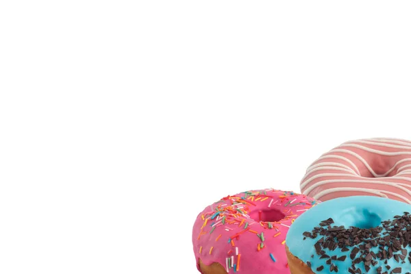 Verschillende heldere smakelijke donuts op een witte achtergrond. Plaats onder de tekst. Diversiteit. — Stockfoto