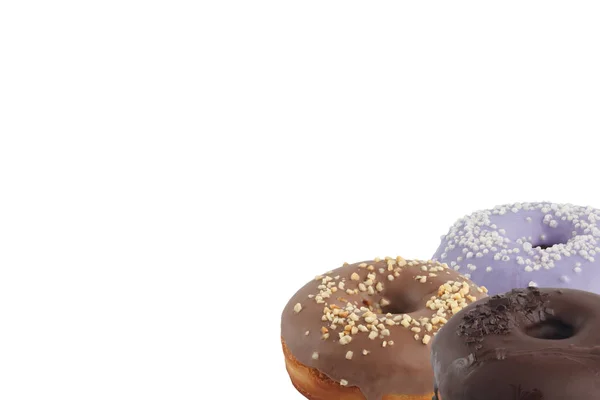 Verschiedene helle leckere Donuts auf weißem Hintergrund. unter dem Text platzieren. Vielfalt. — Stockfoto