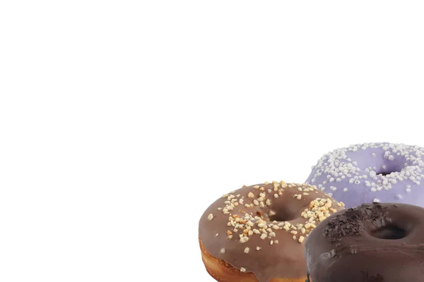 Verschillende heldere smakelijke donuts op een witte achtergrond. Plaats onder de tekst. Diversiteit. — Stockfoto