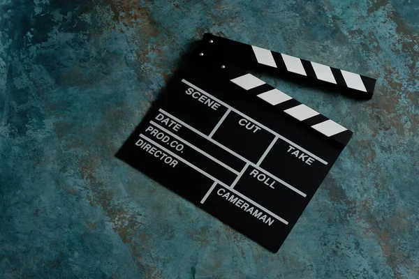 Clapper board with popcorn. Movie concept. Clapperboard on a textural background. Close-up.