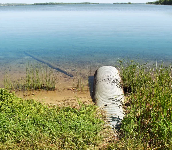 Large Metal Drain Pipe Going Beautiful Blue Lake — Stock Photo, Image