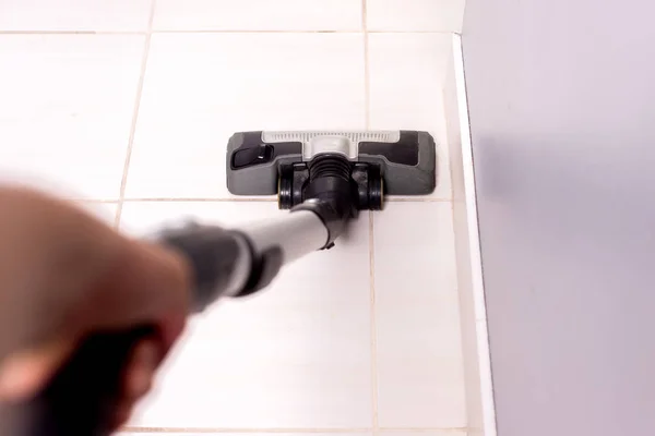 Vacuuming Tiles Kitchen Bathroom Man Dusts Floor Kitchen Using Gray — Stock Photo, Image