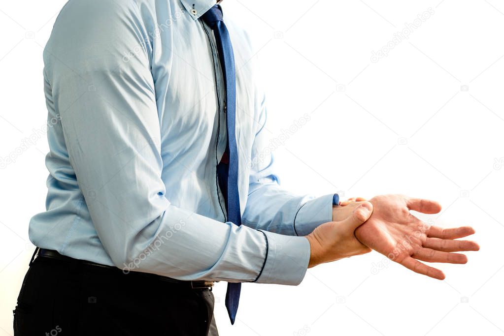 Wrist ache. Pain in the wrist and hand. Businessman is holding his aching hand. Too long computer work, hand fatigue, pain sensation. The concept of healthcare and medicine.