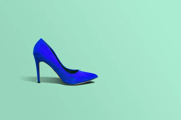 High heels, blue high heel on a yellow pastel background. Fashion concept,  catwalk. Online store, fashion store, sale of shoes. Footwear Female shoes.  A few different shoes. - Stock Image - Everypixel