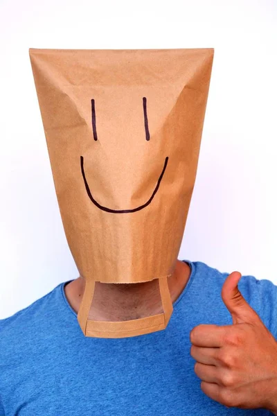 paper bag over the head with smile on it