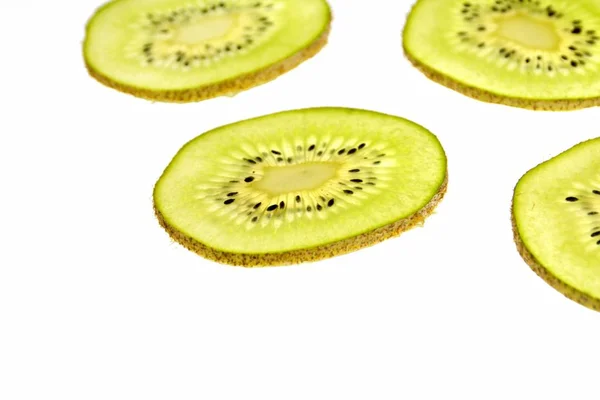 Sliced Kiwi Lies Light Background Thin Kiwi Slices Illuminated — Stock Photo, Image