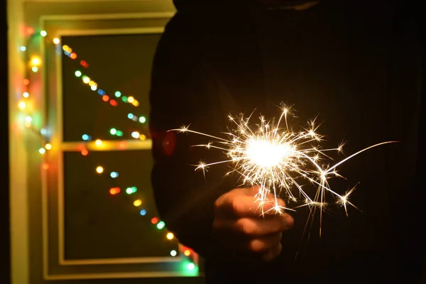 Holding Sparkler Front Colorful Fairy Lights — Stock Photo, Image