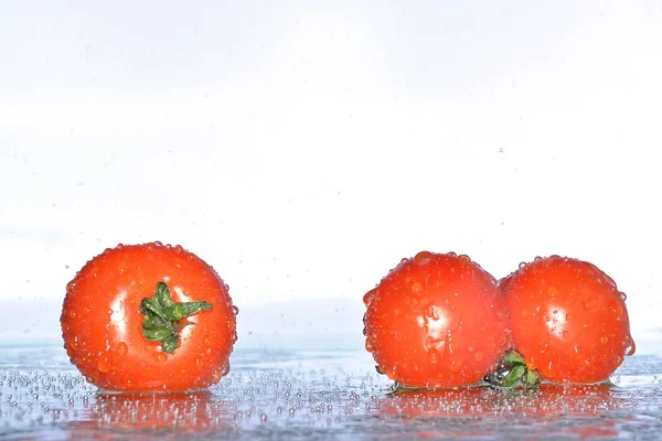 Tomaten Wasserspritzer — Stockfoto