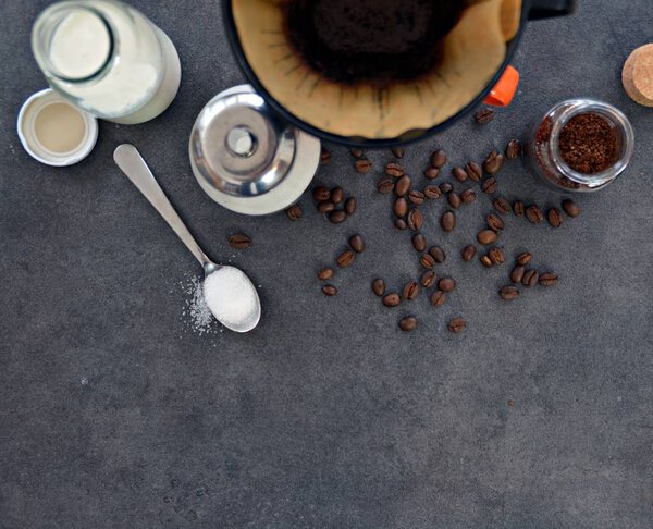  coffee in a cup with milk and sugar beside 