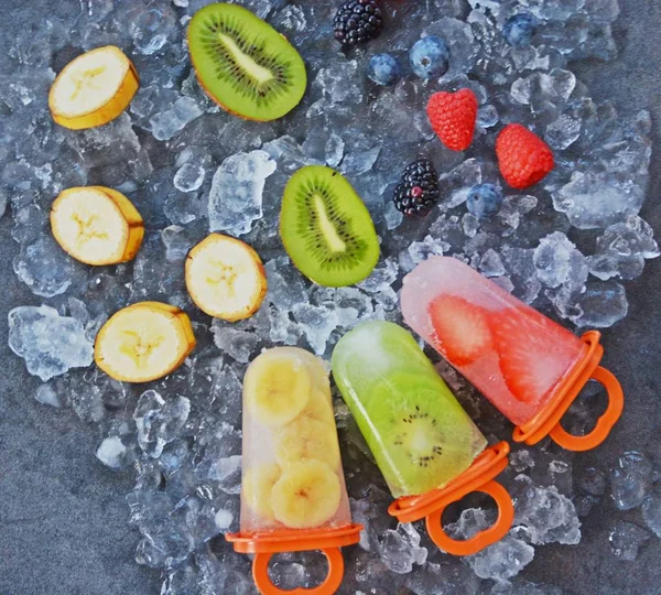 fruit ice with pieces of fruits on ice cubes