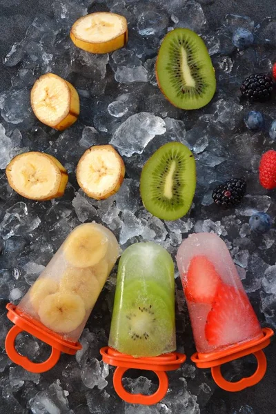 fruit ice with pieces of fruits on ice cubes