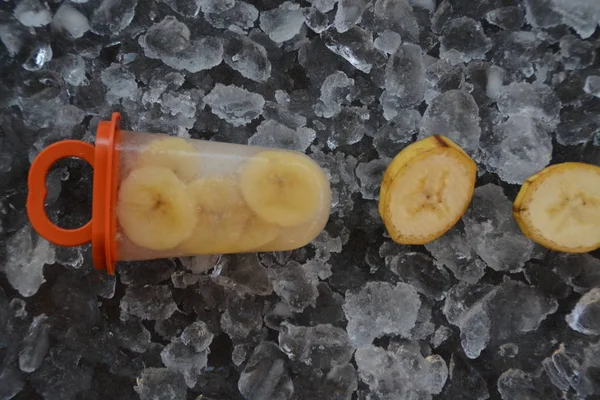 Homemade banana ice cream with pieces on ice cubes