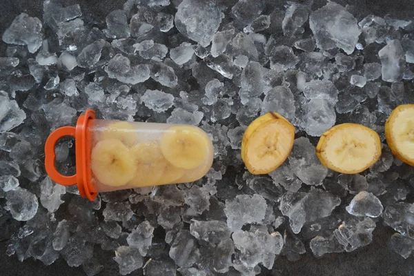 Homemade banana ice cream with pieces on ice cubes