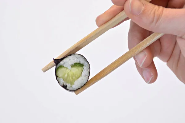Comer Sushi Forma Corazón Con Pepino Con Palillos Cerca Como —  Fotos de Stock