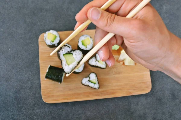 Cucumber sushi in heart shape as symbol for lovin sushi