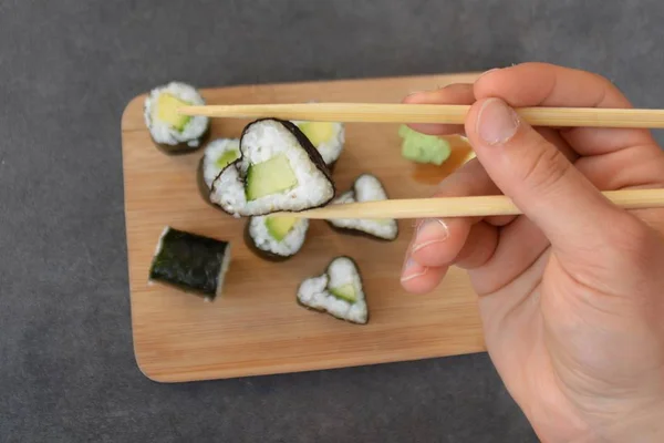 Cucumber sushi in heart shape as symbol for lovin sushi