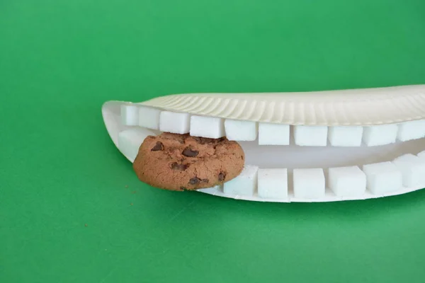 Teeth Made Out Sugar Cubes Biting Cookie Front Colorful Background — Stock Photo, Image