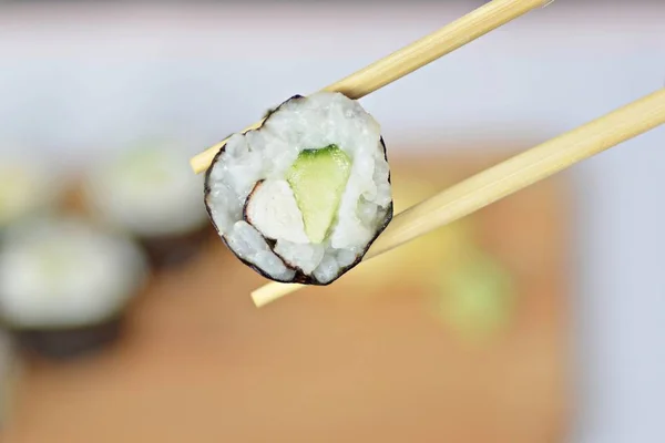 Cucumber sushi in heart shape as symbol for loving sushi