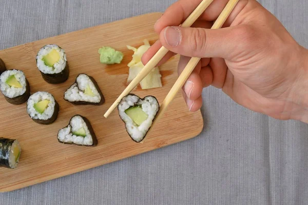 Cucumber sushi in heart shape as symbol for lovin sushi