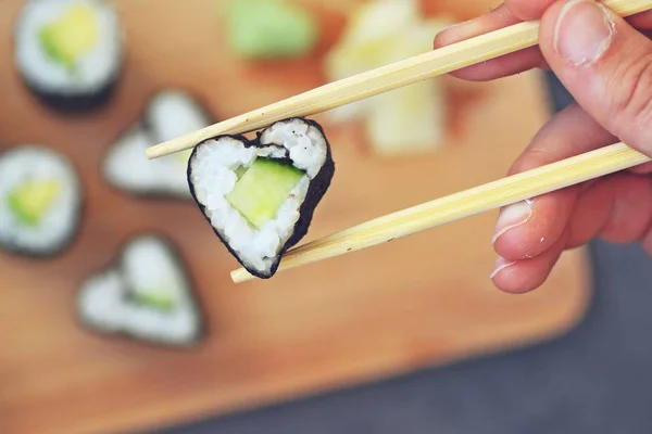 Cucumber sushi in heart shape as symbol for lovin sushi