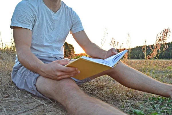 https://st4.depositphotos.com/12499764/28029/i/450/depositphotos_280291458-stock-photo-close-man-reading-book-countryside.jpg