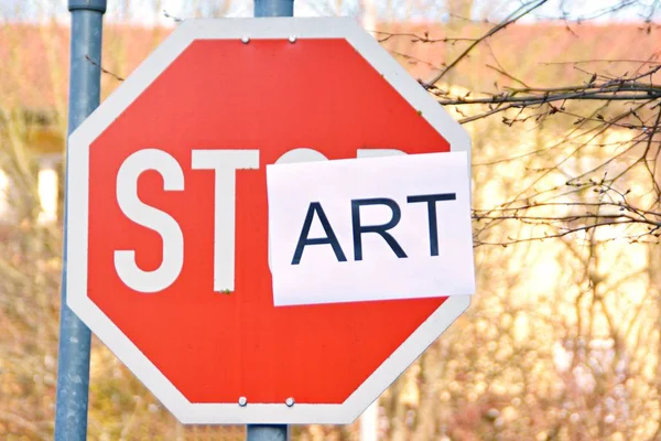 In the case of a stop sign, a part of the letters was pasted over and thus the term start read - concept with the background that every end is the chance for a new start