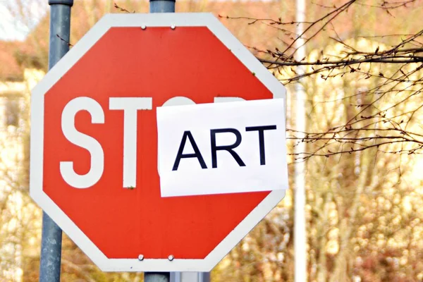 In the case of a stop sign, a part of the letters was pasted over and thus the term start read - concept with the background that every end is the chance for a new start