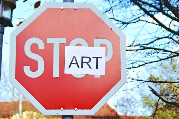 In the case of a stop sign, a part of the letters was pasted over and thus the term start read - concept with the background that every end is the chance for a new start