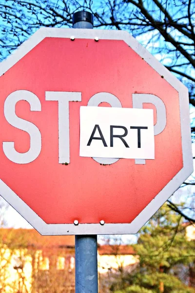 In the case of a stop sign, a part of the letters was pasted over and thus the term start read - concept with the background that every end is the chance for a new start