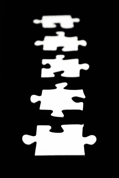 White Puzzle Pieces Black Background Certain Distance Individual Parts Concept — Stock Photo, Image