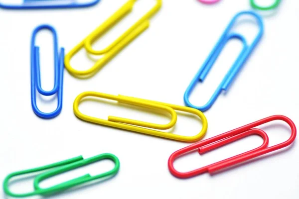 Various Colored Paper Clips Lie White Surface Background Consisting White — Stock Photo, Image