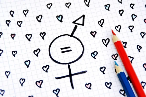 A sign for the equality of man and woman consisting of the respective gender signs and a same with partly painted hearts on a drawn sheet drawn - equality man and woman symbolically represented