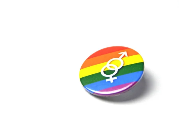 Ein Knopf Mit Dem Zeichen Für Transsexualität Liegt Auf Weißem — Stockfoto
