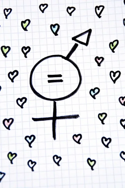 A sign for the equality of man and woman consisting of the respective gender signs and a same with partly painted hearts on a drawn sheet drawn - equality man and woman symbolically represented