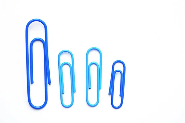 Various Large Blue Paper Clips Lie Side Side White Surface — Stock Photo, Image