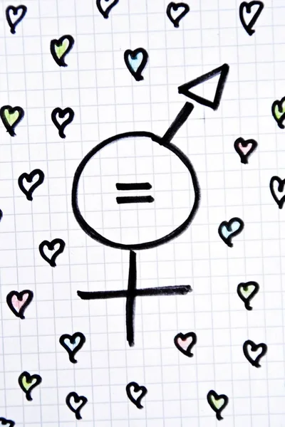 A sign for the equality of man and woman consisting of the respective gender signs and a same with partly painted hearts on a drawn sheet drawn - equality man and woman symbolically represented