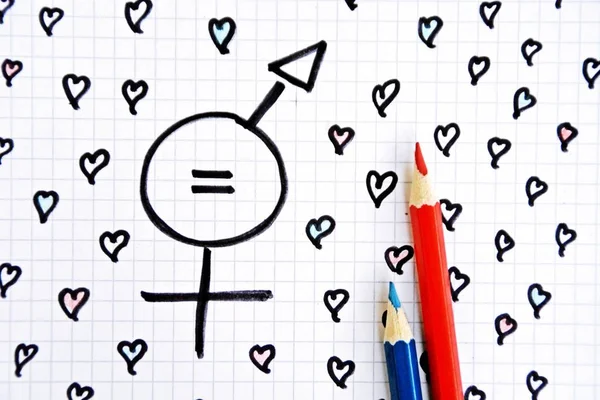 A sign for the equality of man and woman consisting of the respective gender signs and a same with partly painted hearts on a drawn sheet drawn - equality man and woman symbolically represented